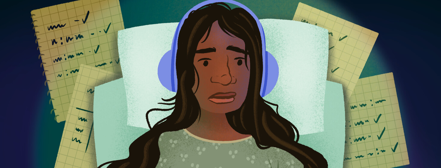 Woman with headphones in MRI machine worries about notes recording her seizures