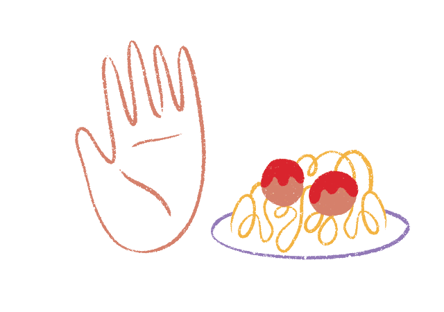 a hand stoping a plate of spaghetti and meatballs 