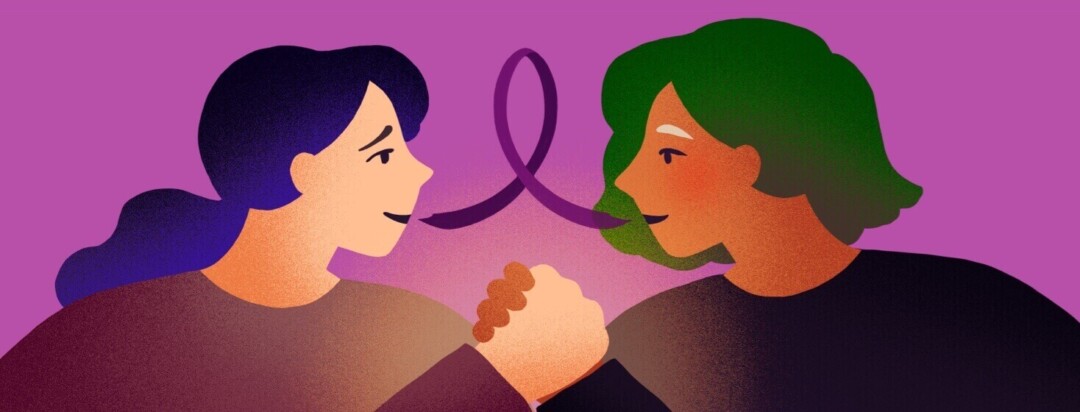 Two women hold hands in a show of support as a purple ribbon shaped speech bubble comes from their mouths