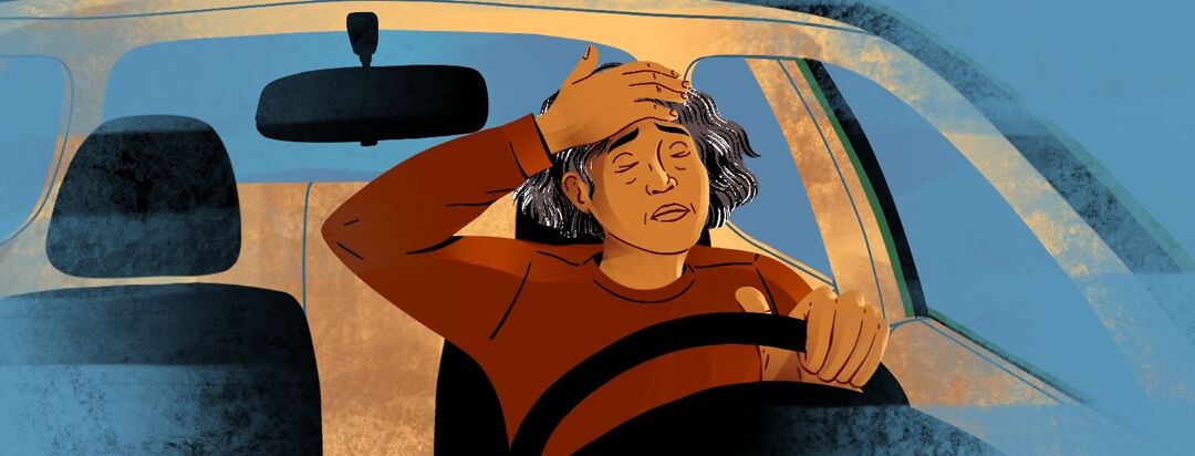 A frustrated and stressed woman driving a car